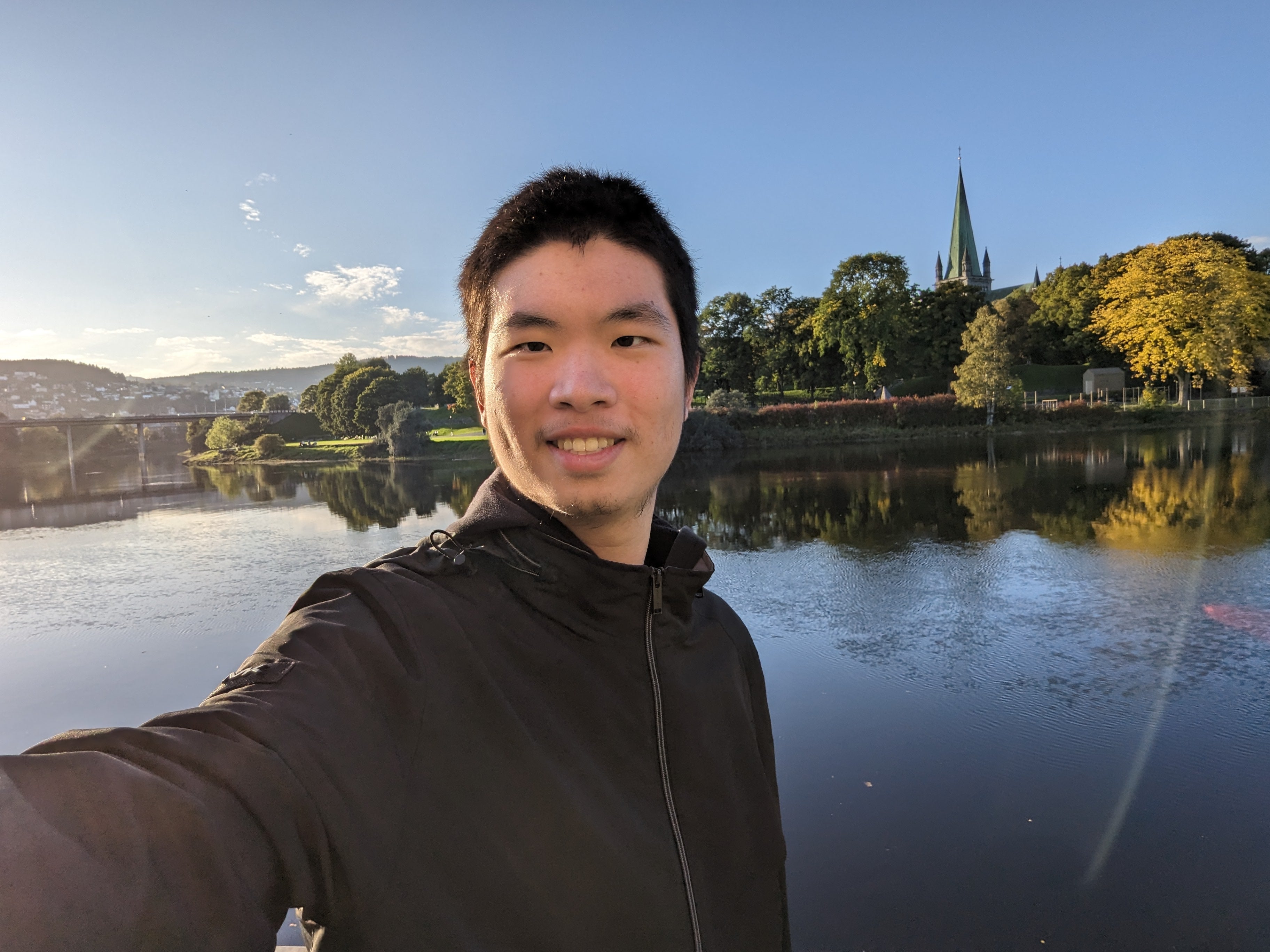 Raymond standing in front of a lake.