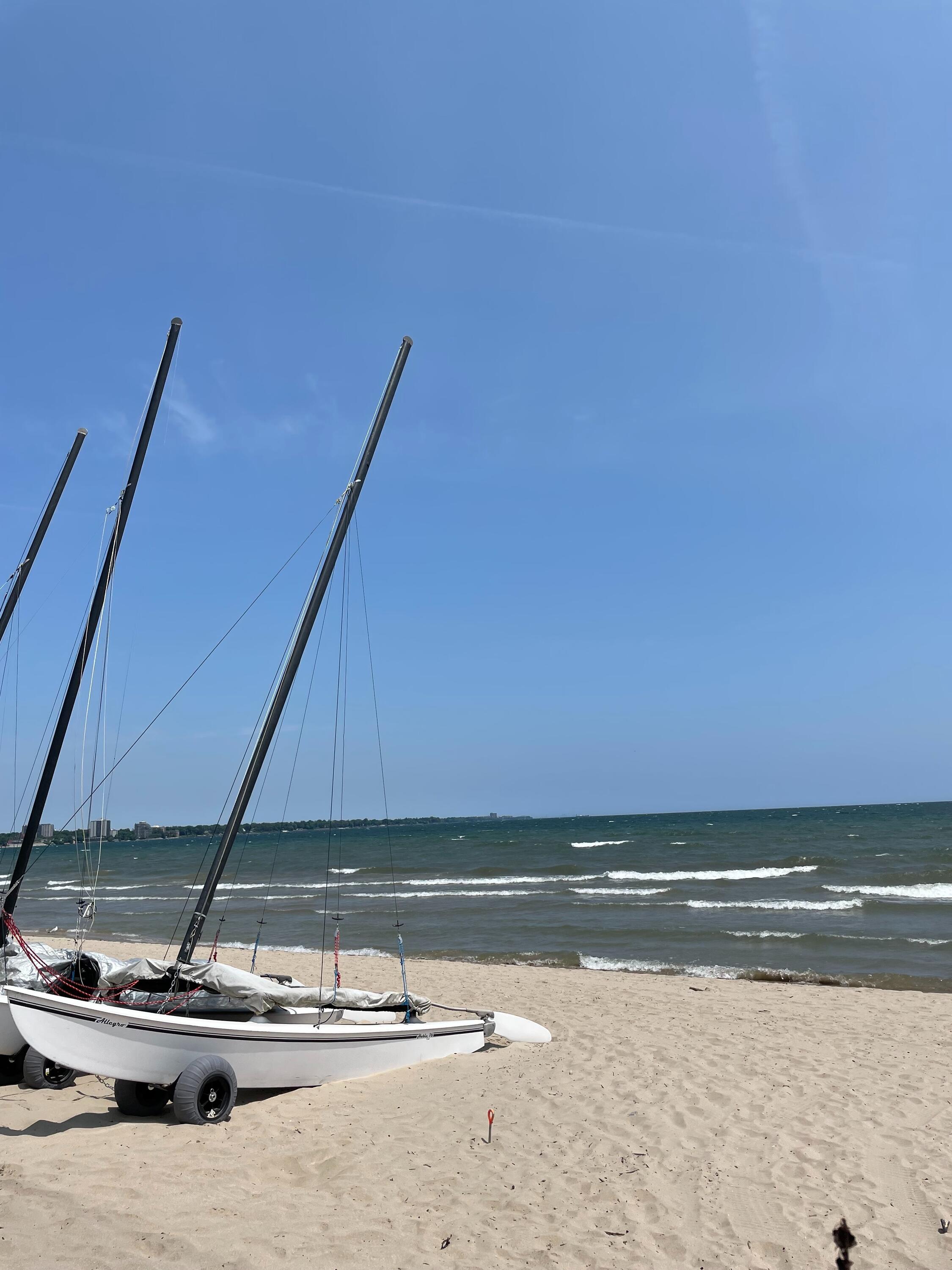 Sailboat on the shore of a lake. 