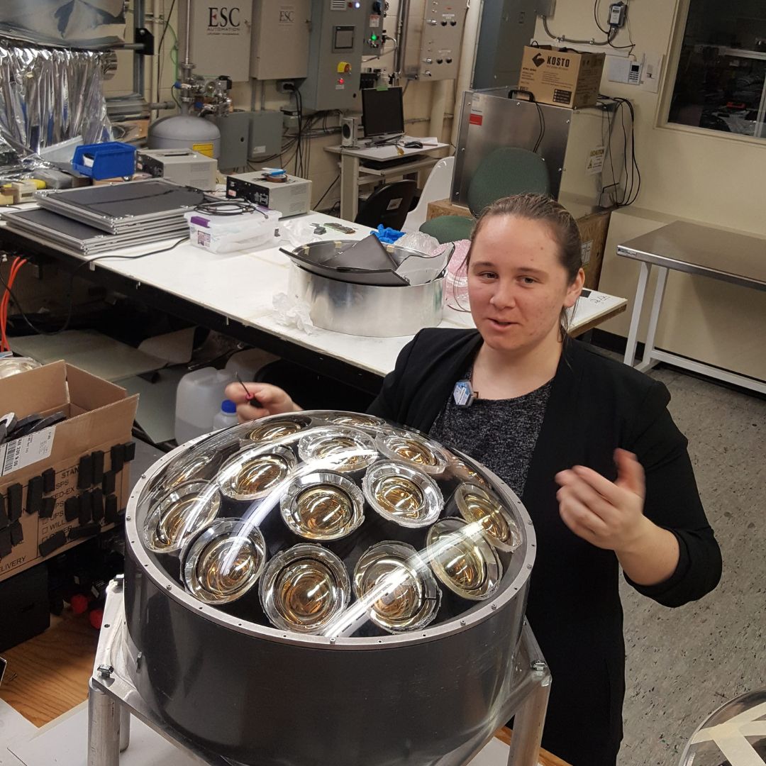 Ashley Ferreira working with equipment in a lab.