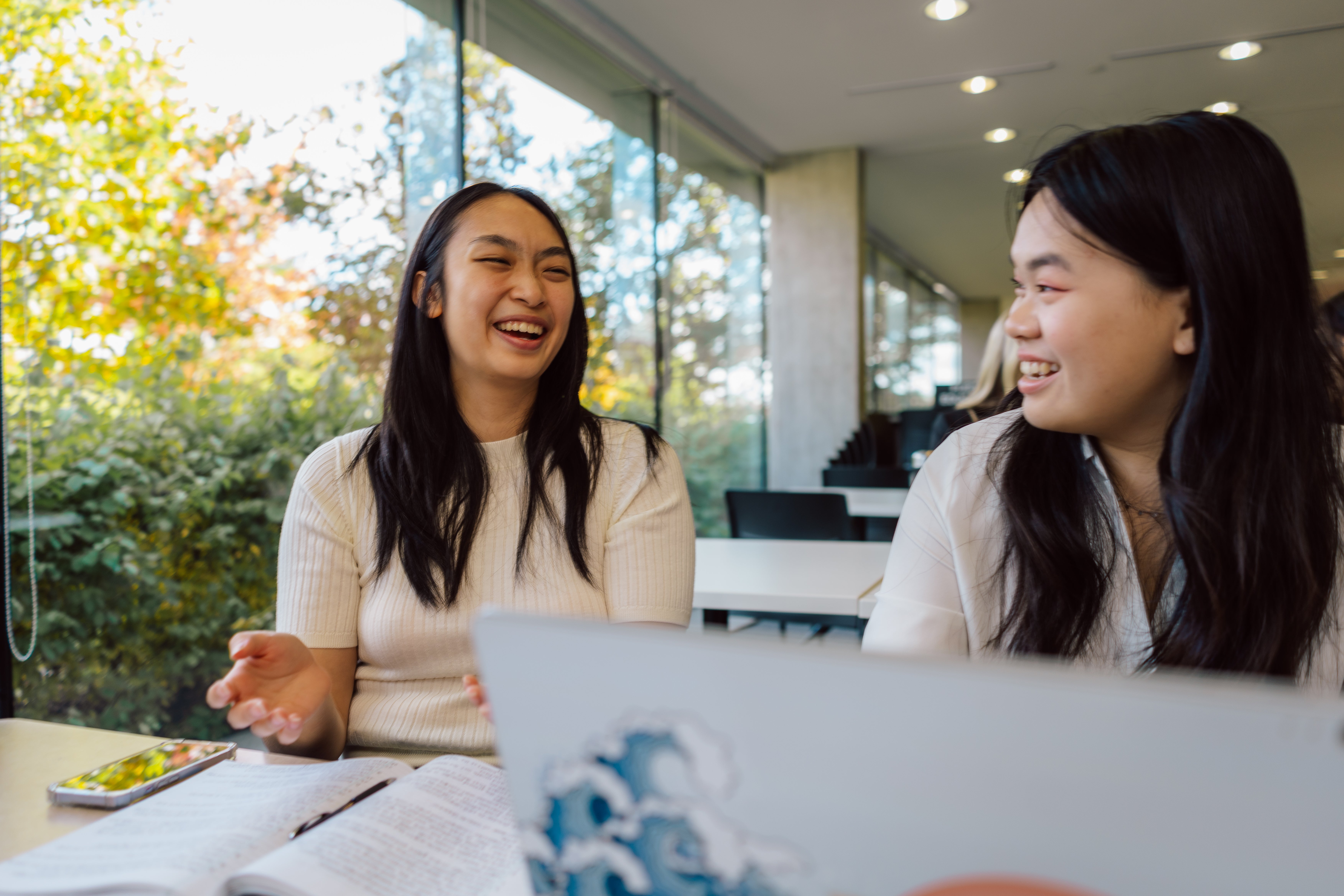 two women smiling at each other