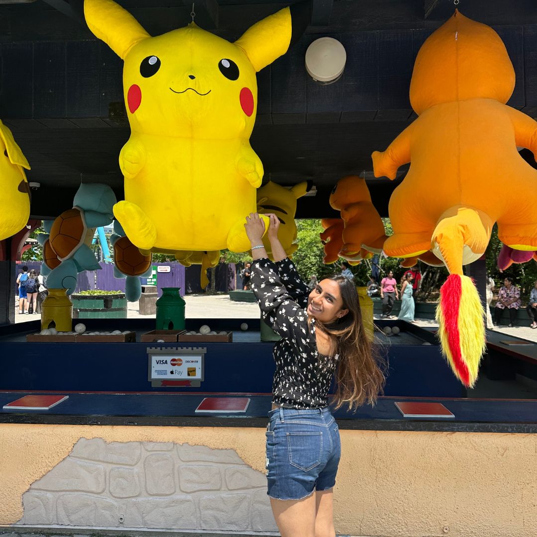 Kavya Gupta reaching for a stuffed animal.