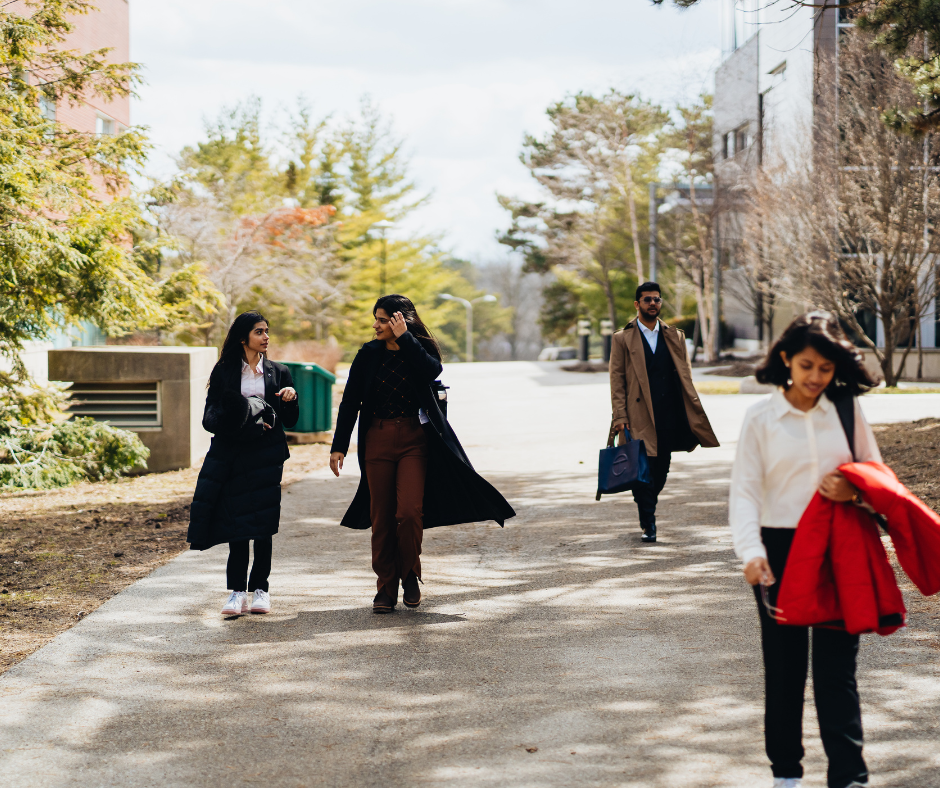 Co-op students walking outside of Tatham Centre.