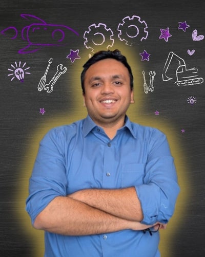Dhruvil posing in front of Engineering icons