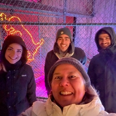 Myra with students outside in the winter