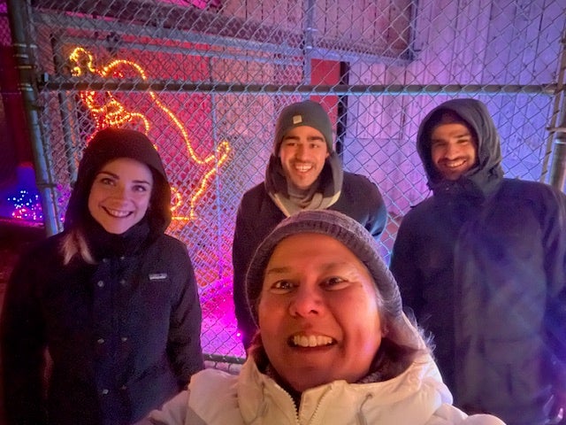 Myra with students outside in the winter