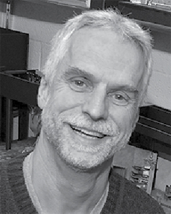 black and white head shot of Bill Chesney