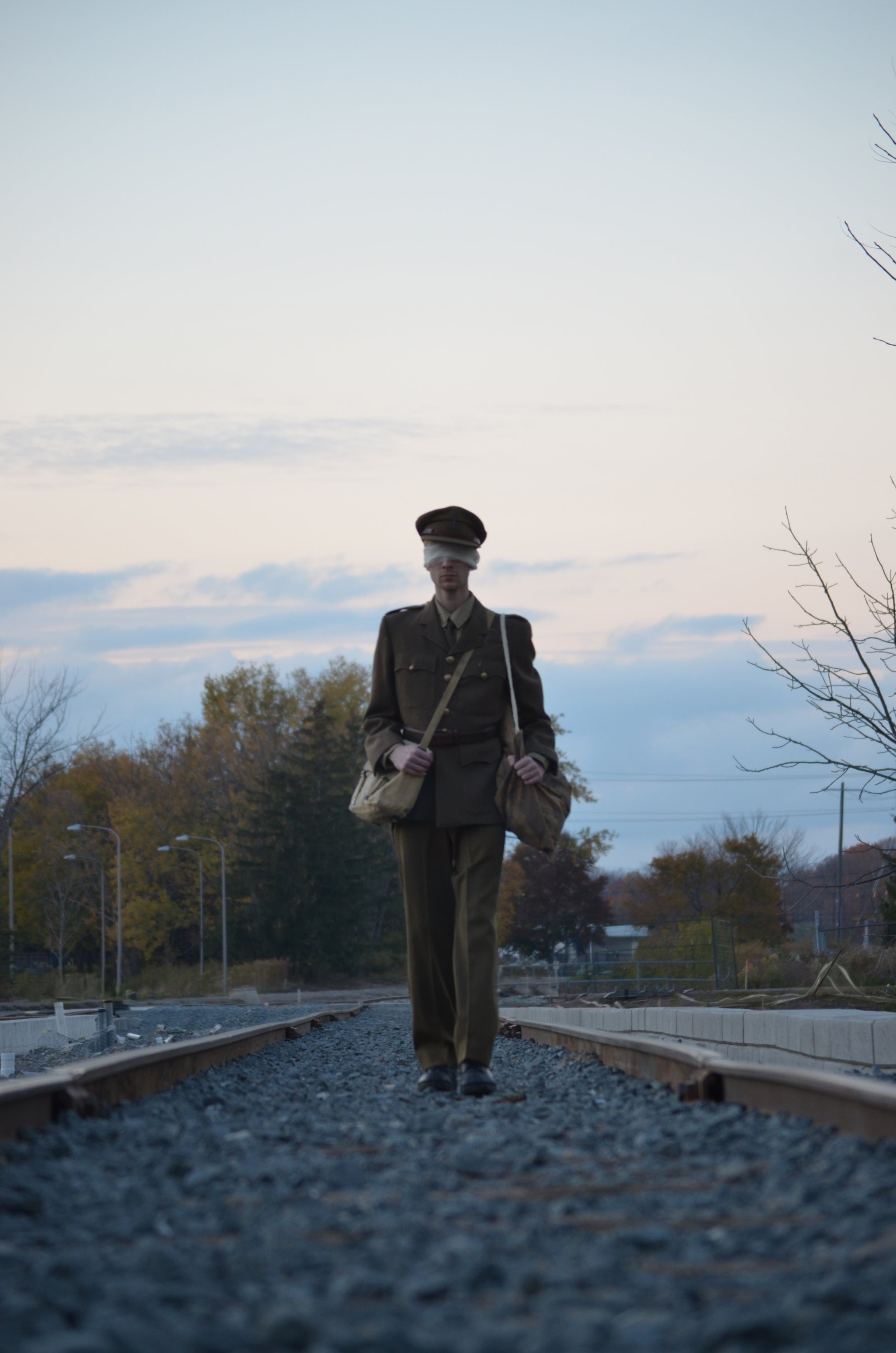 Solider walking a train track