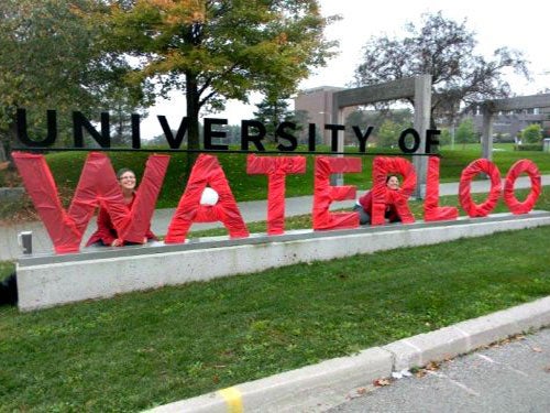 University of Waterloo front signage covered in red for United Way