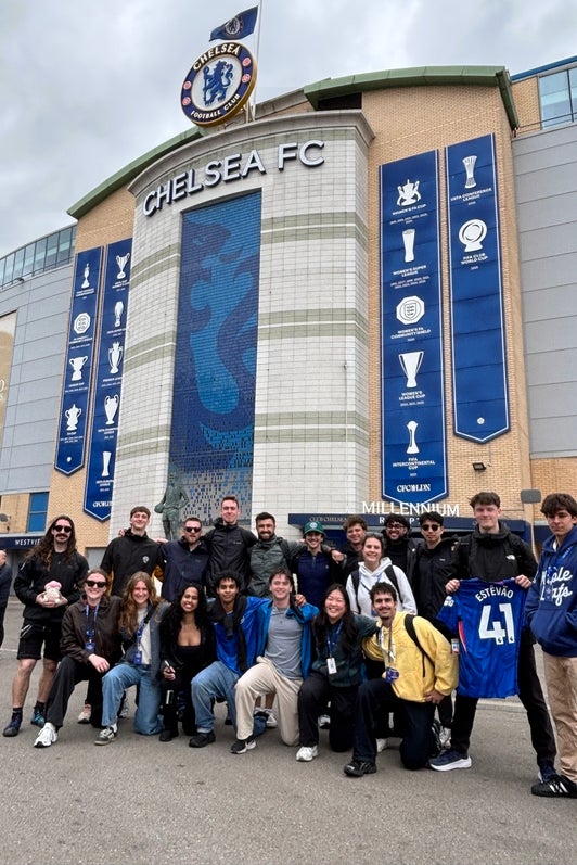 Group of students gathered in front of Chelsea FC Football stadium 