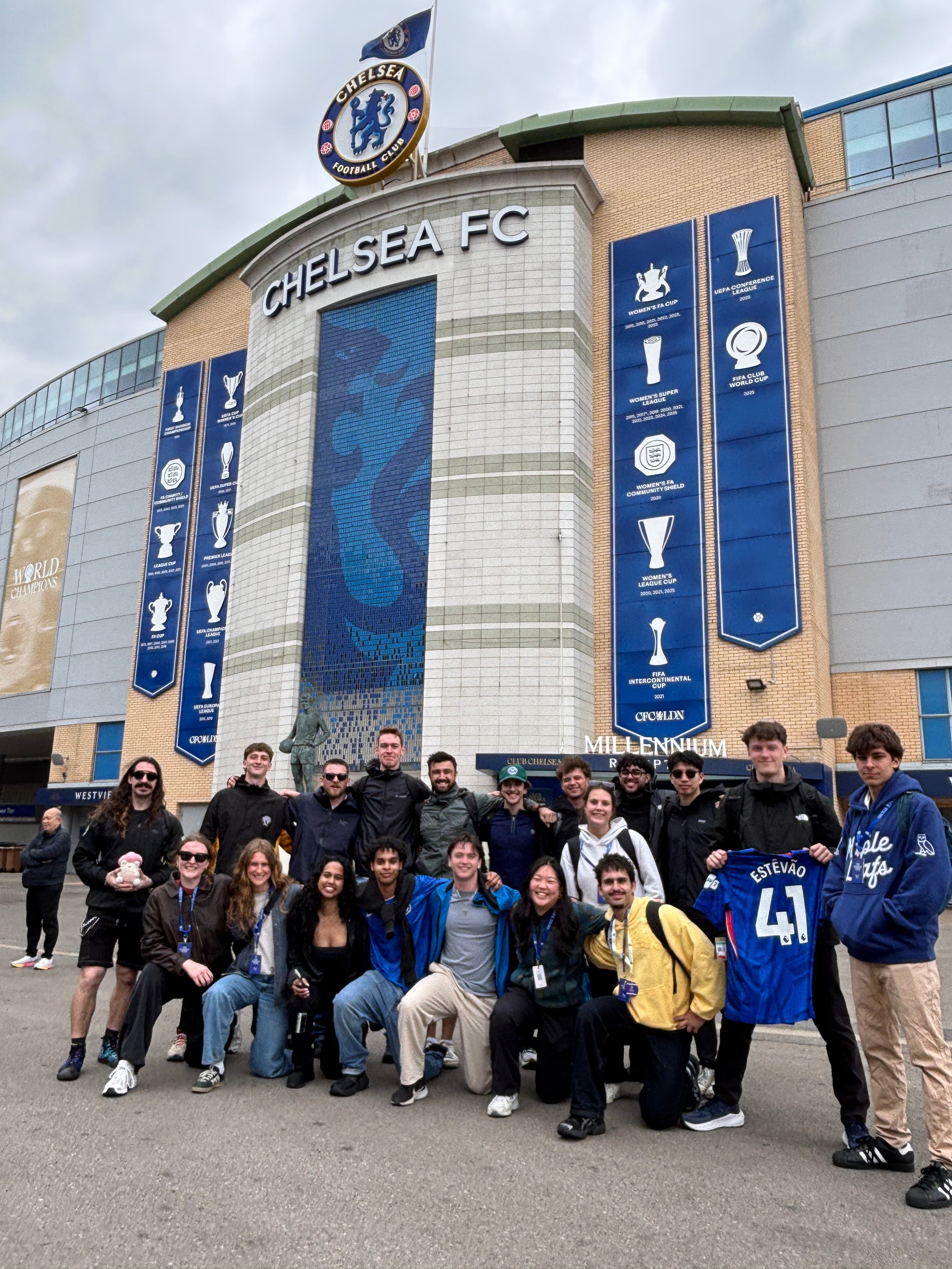 Group of students gathered in front of Chelsea FC Football stadium 