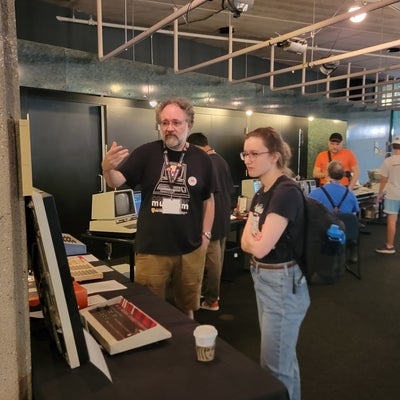 Scott discusses Tape Drive with visitor
