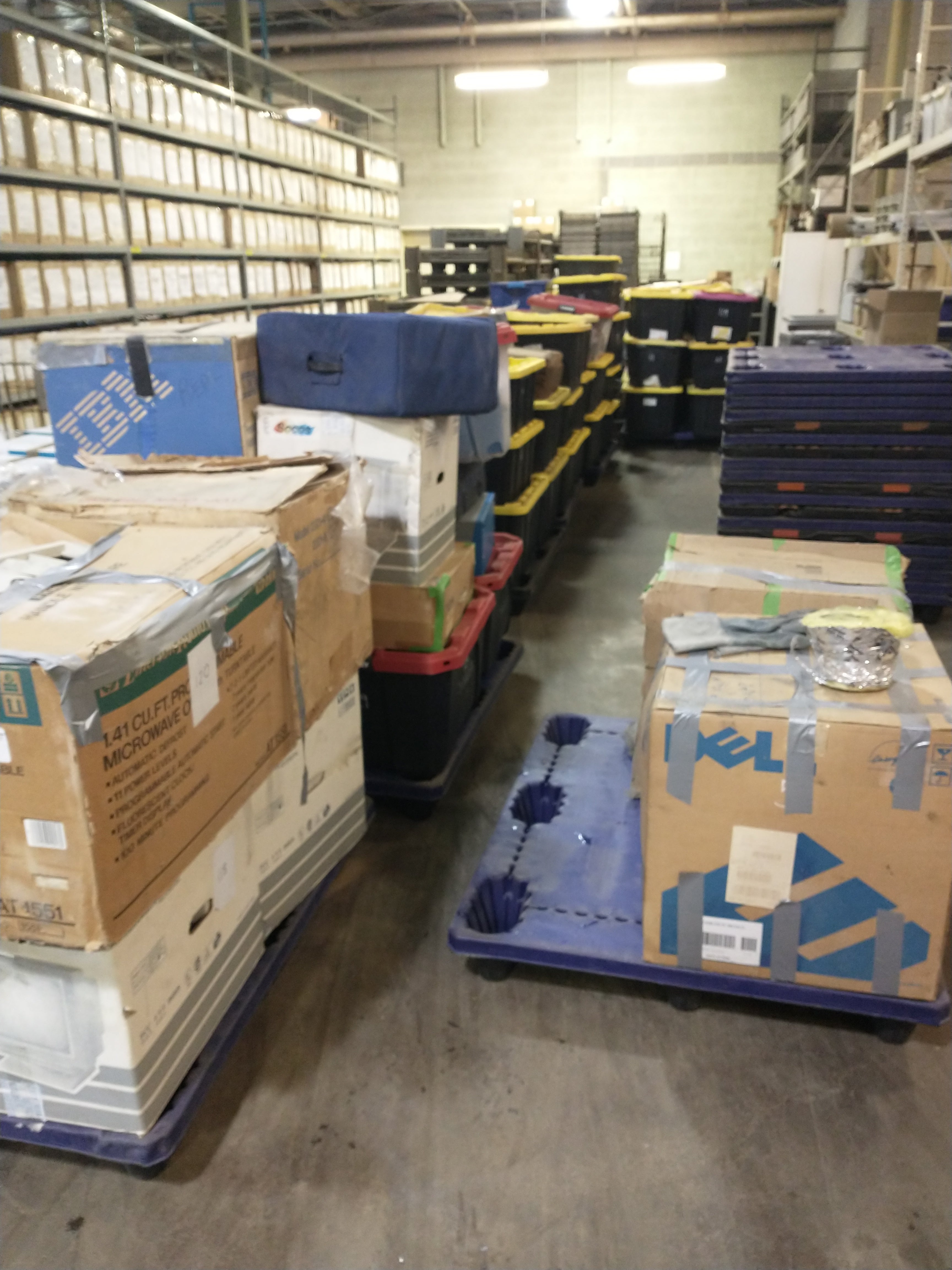 Tom Conrad donation unloaded into Central Stores