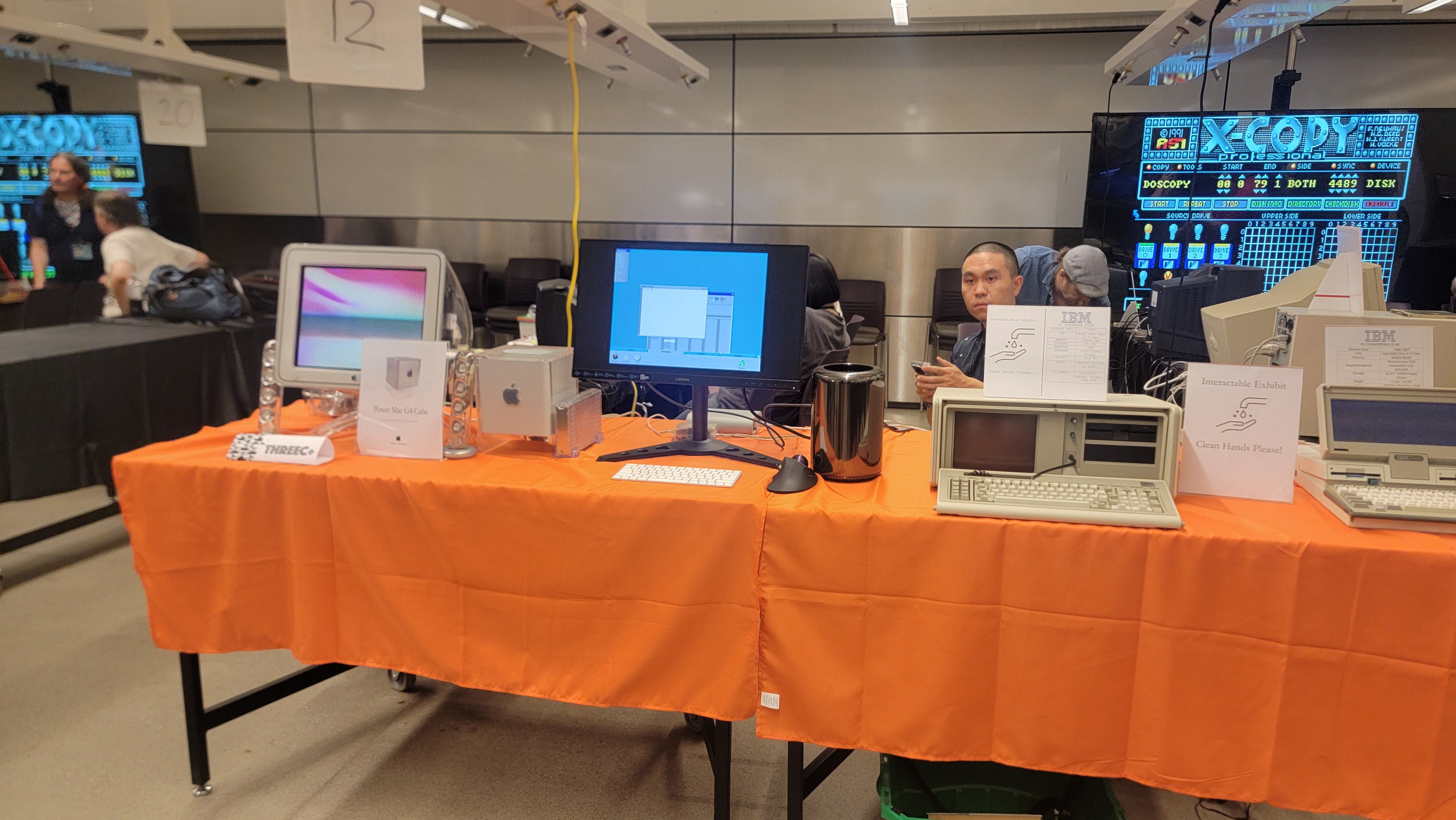 Table displaying different retro computers, such as an early generation Macintosh computer.
