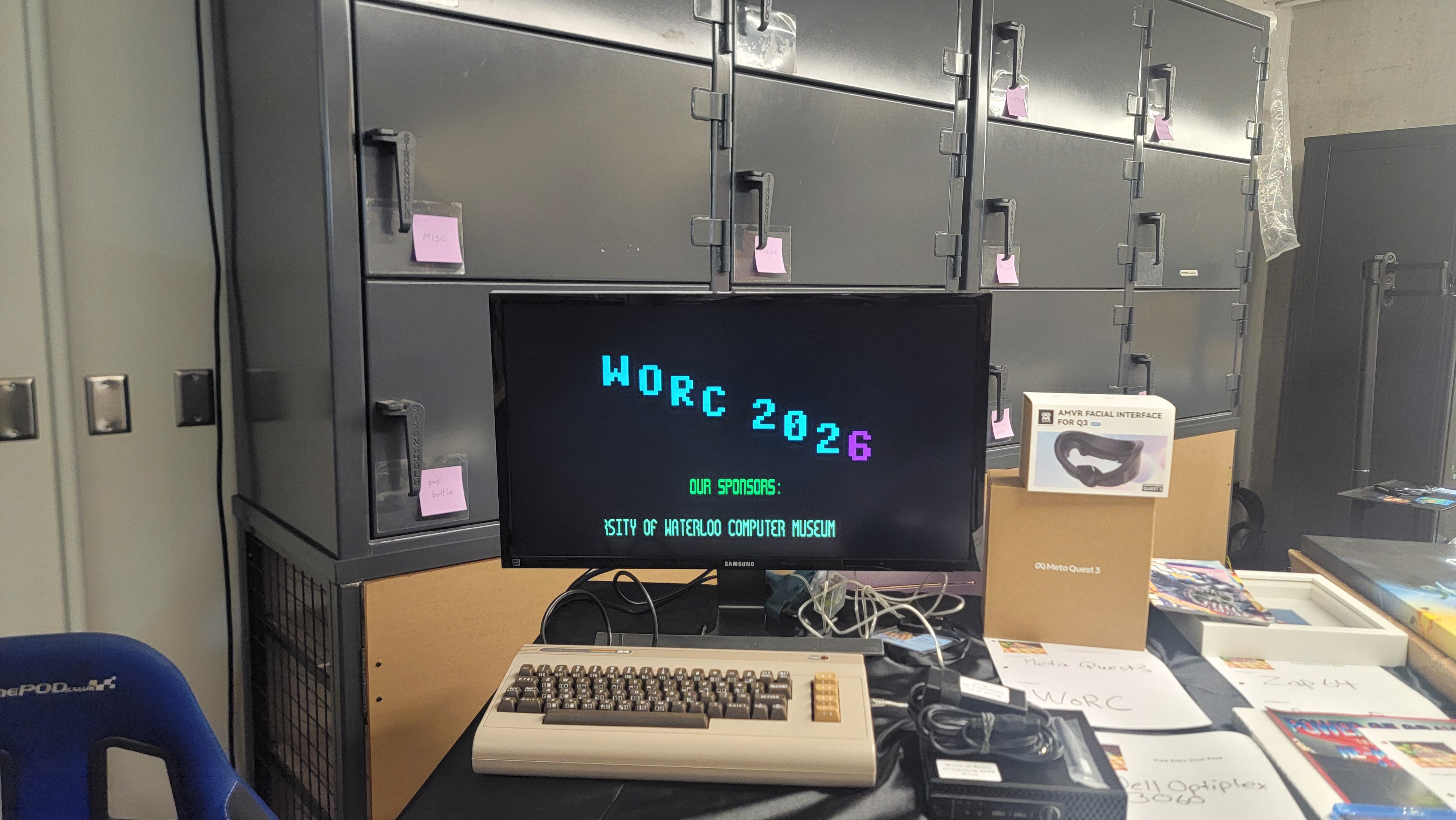 The welcome booth displaying the words "WORC 2026 - Our Sponsors: University of Waterloo Computer Museum".