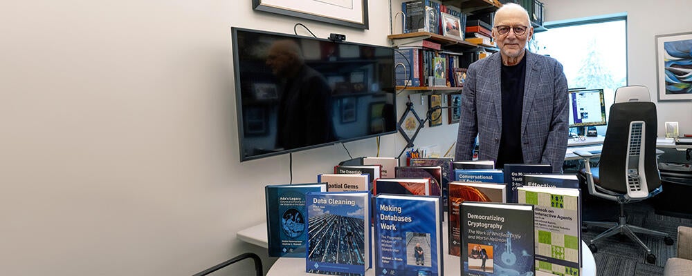 photo of University Professor M. Tamer Oszu with ACM book series