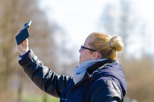 Stock image of woman taking a selfie