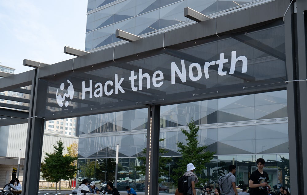 image on building with "Hack the North" on awning