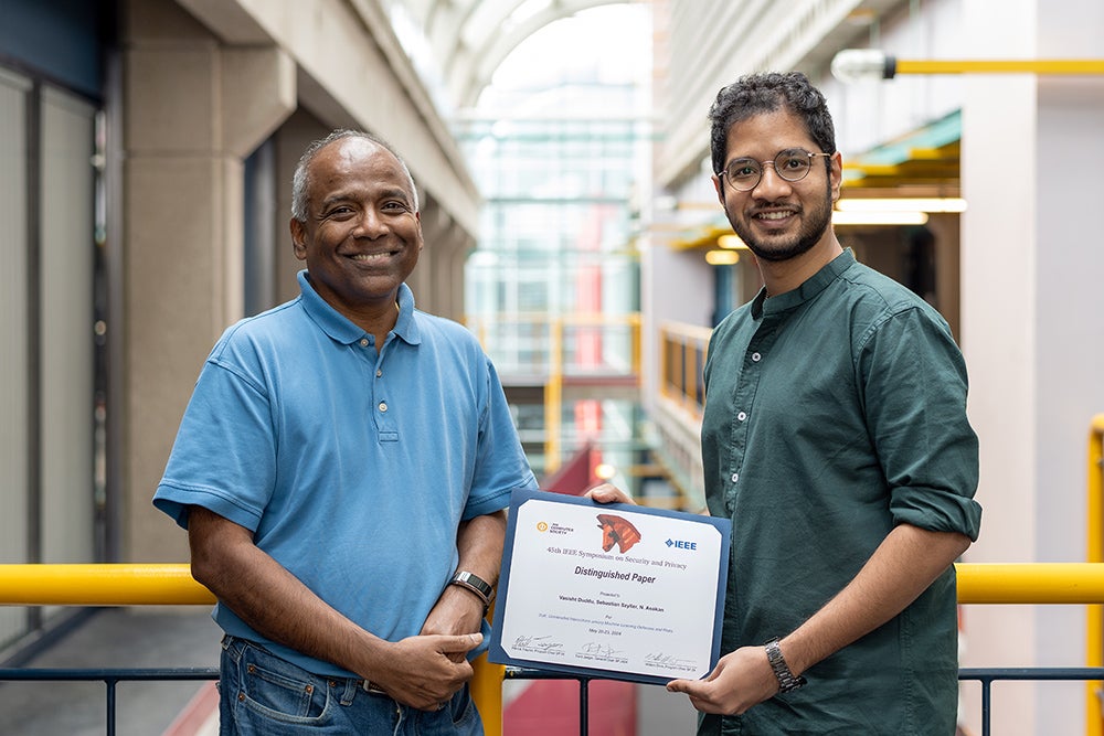 photo of Professor N. Asokan and PhD candidate Vasisht Duddu