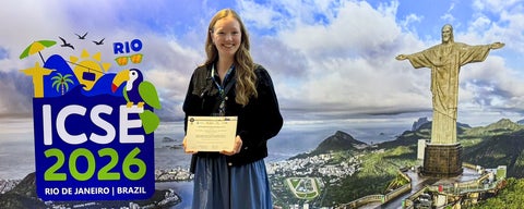 Evelien Riddell holding distinguished paper award certificate at FORGE 2026