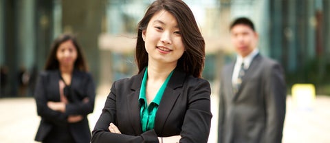 students in business casual posing