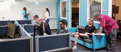 Graduate students working in an office