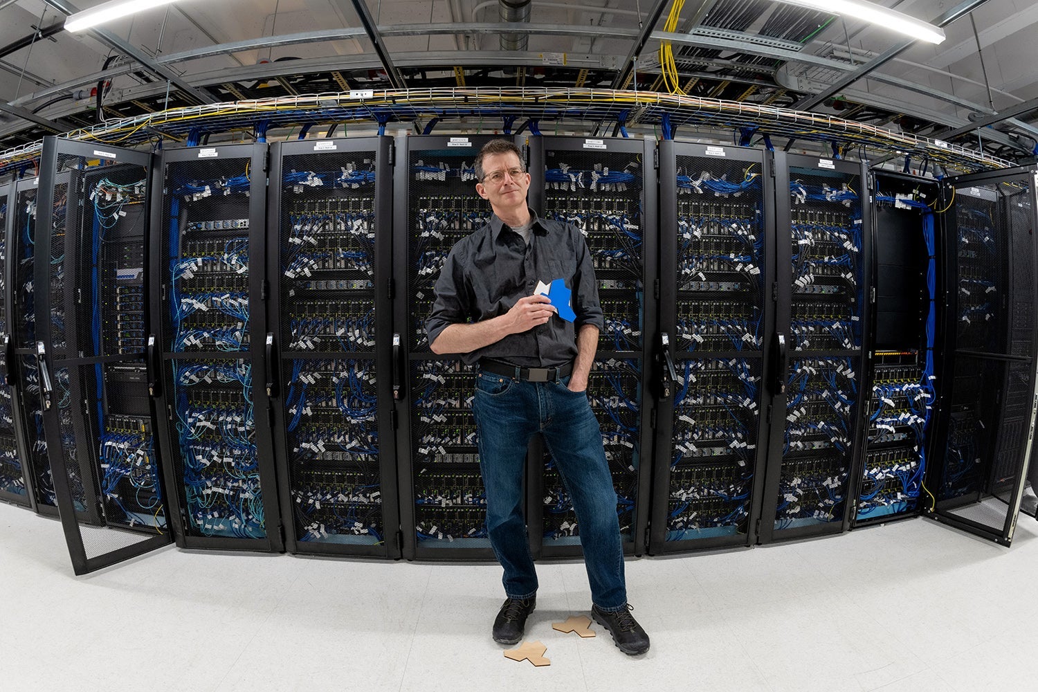 photo of Professor Craig S. Kaplan holding two einstein tiles