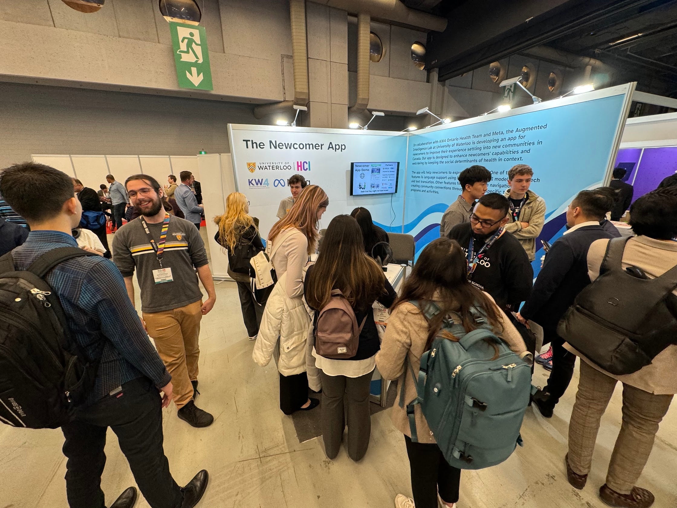 crowd of people in front of the booth