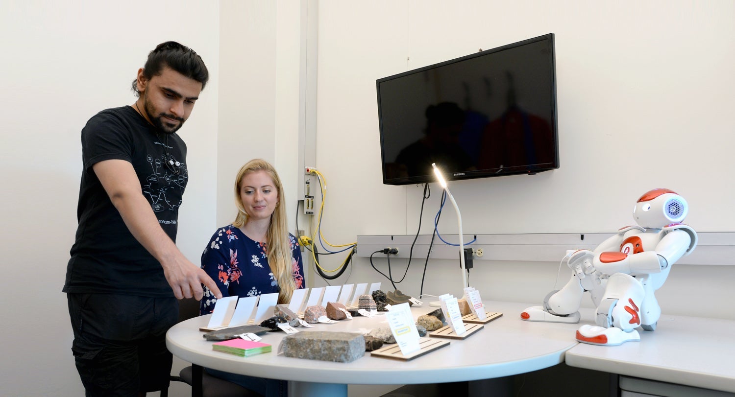 photo of Nalin Chhibber, Jessy Ceha and NAO, a humanoid educational robot