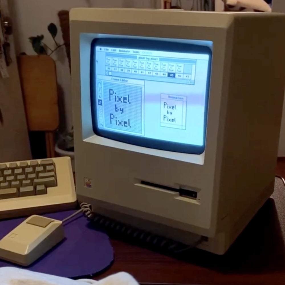 iconic Macintosh computer with Pixel by Pixel on its screen