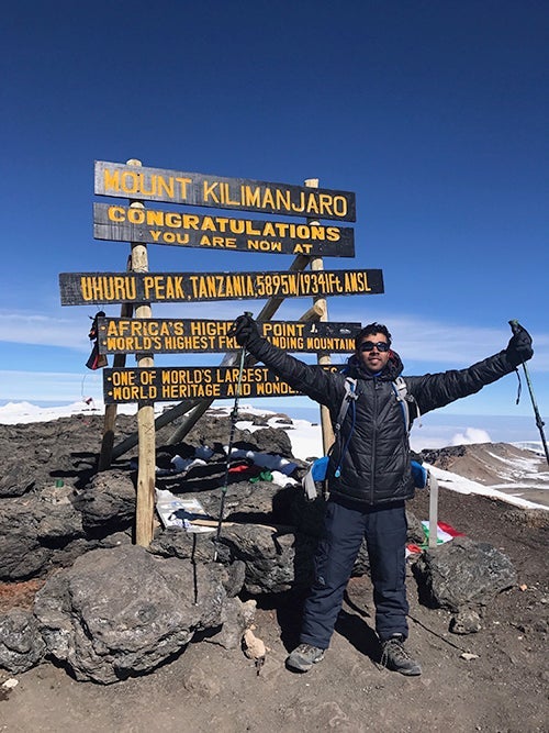 Sam Pasupalak at the peak of Mount Kilimanjaro