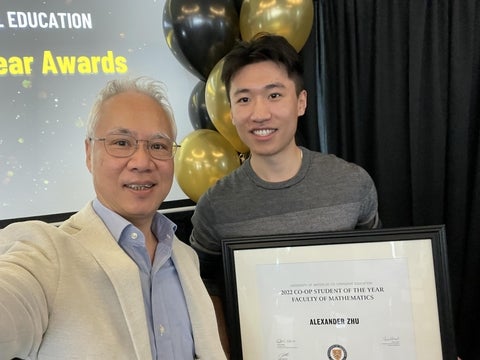 CFM Co-Director Justin Wan and CFM student Alex Z. posing with Co-op Student of the Year award