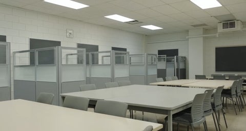 Tables and chairs in a classroom for tutoring support