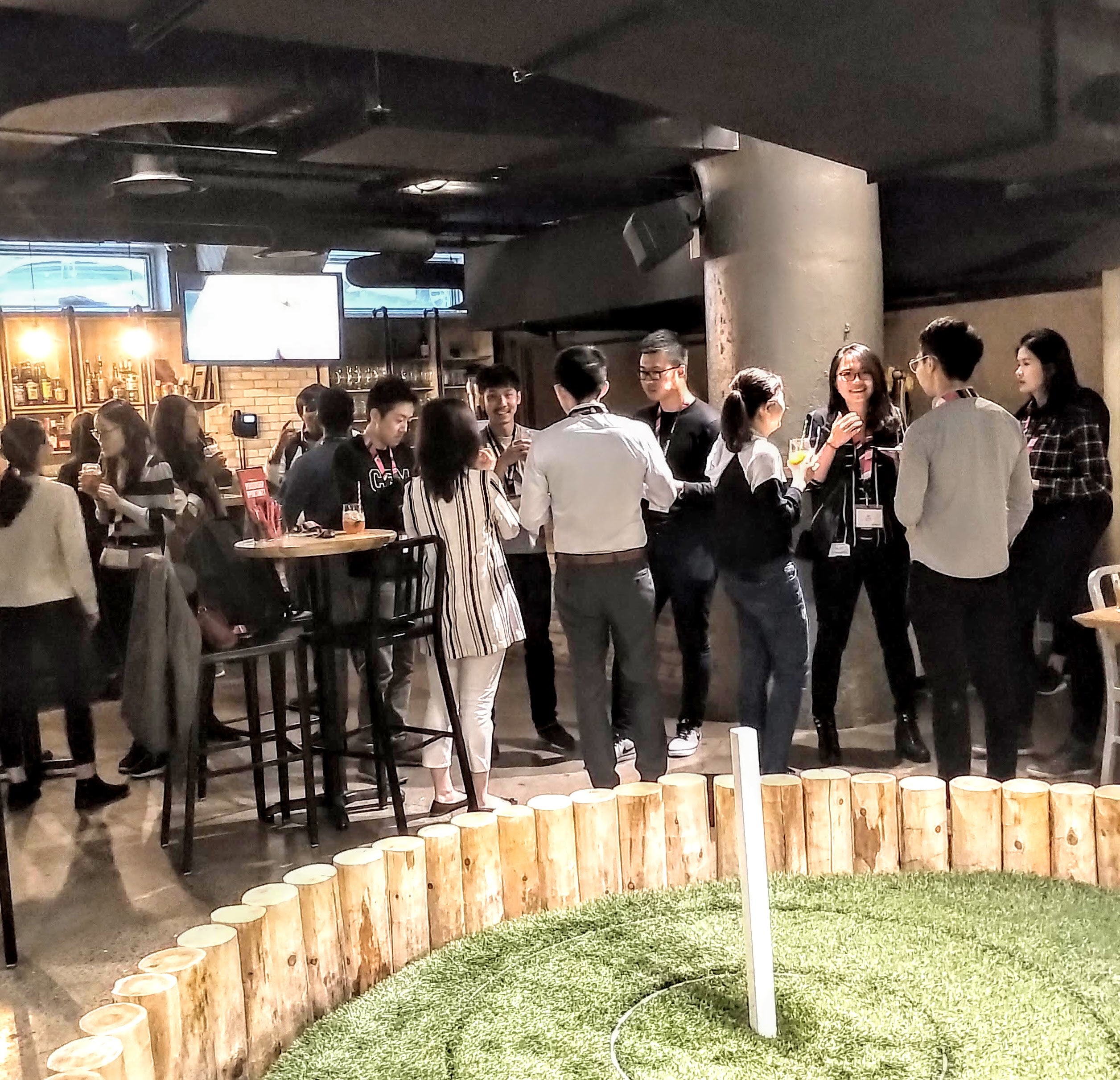 A group of 20 people eating and chatting