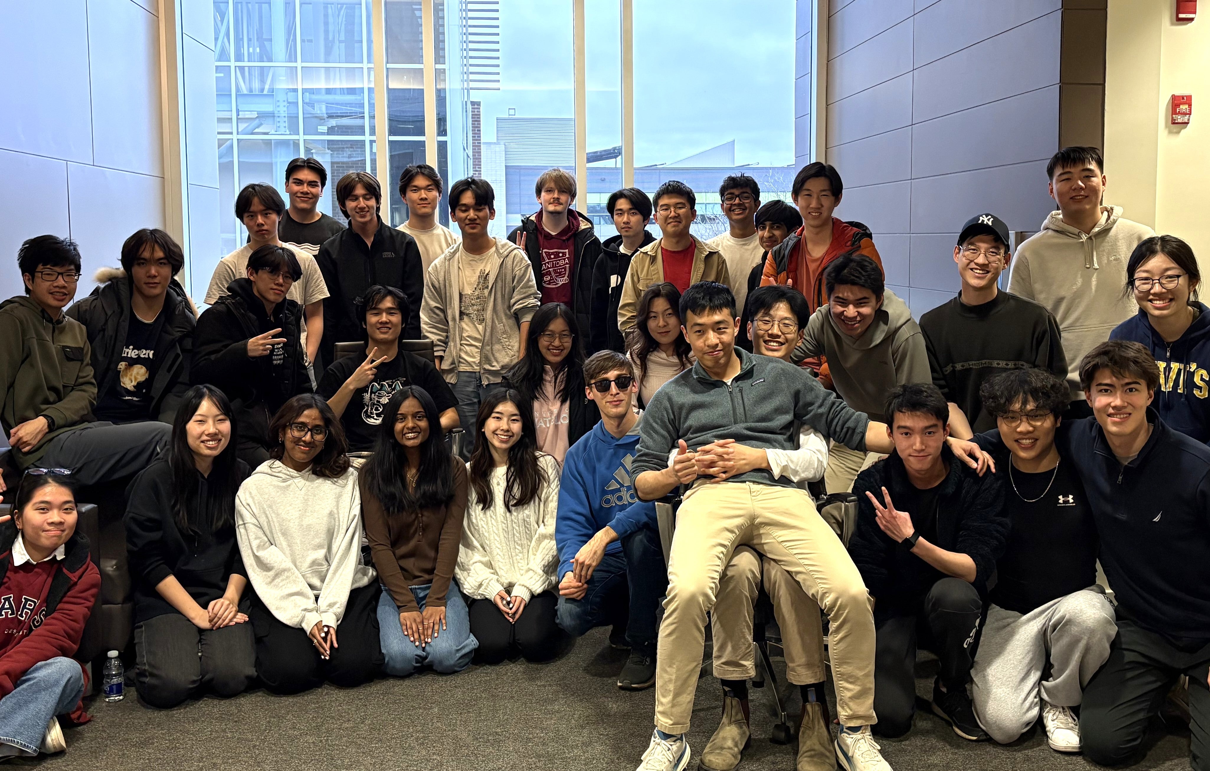 Twenty five students posing for a group photo