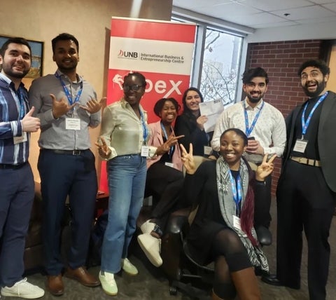 students smiling after winning pitch competition 