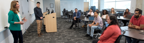 A speaker teaching a class