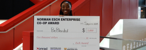 An Enterprise Co-op pitch winner with her cheque