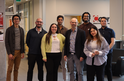 Prof. Marc Hurwitz poses with a group of MBET students