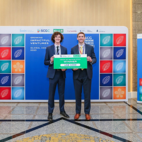 Andrew Cordssen-David and Kade Truman (both MBET '23) with their cheque for winning Best 60 Second Pitch at the Bangkok Business Challenge