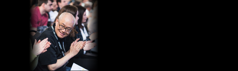 Prof. Wayne Chang memorial banner, clapping and smiling