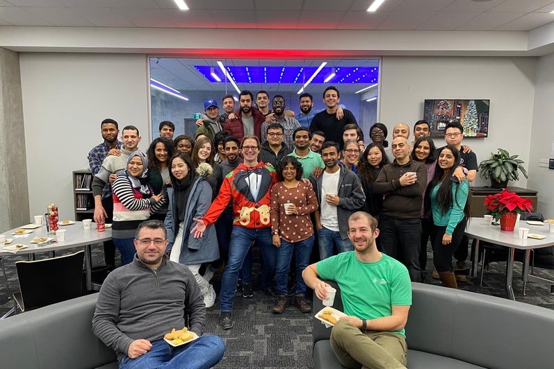 Winter break celebrations: Full-time MBET students gather in the Conrad School Hub to celebrate before the winter holiday break.