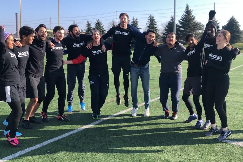 Sporty MBETs: A group of full-time MBET students celebrate a win on Warrior Field.