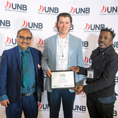 Charles Huxley and Tom Kizito receiving 3rd Place Graduate Track prize