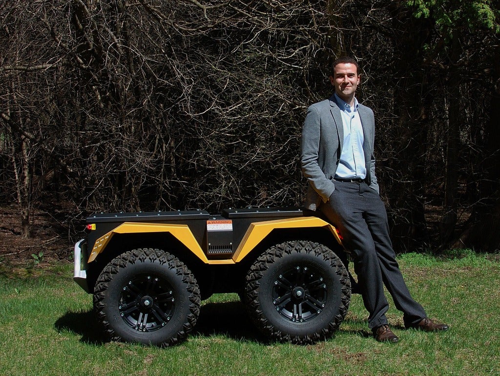 Matt Rendall, Clearpath Co-founder and CEO pictured with one of their robots.