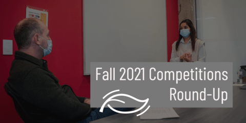 Image of a masked student pitching to a masked coach. Text overlay reads: Fall 2021 Competitions Round-Up
