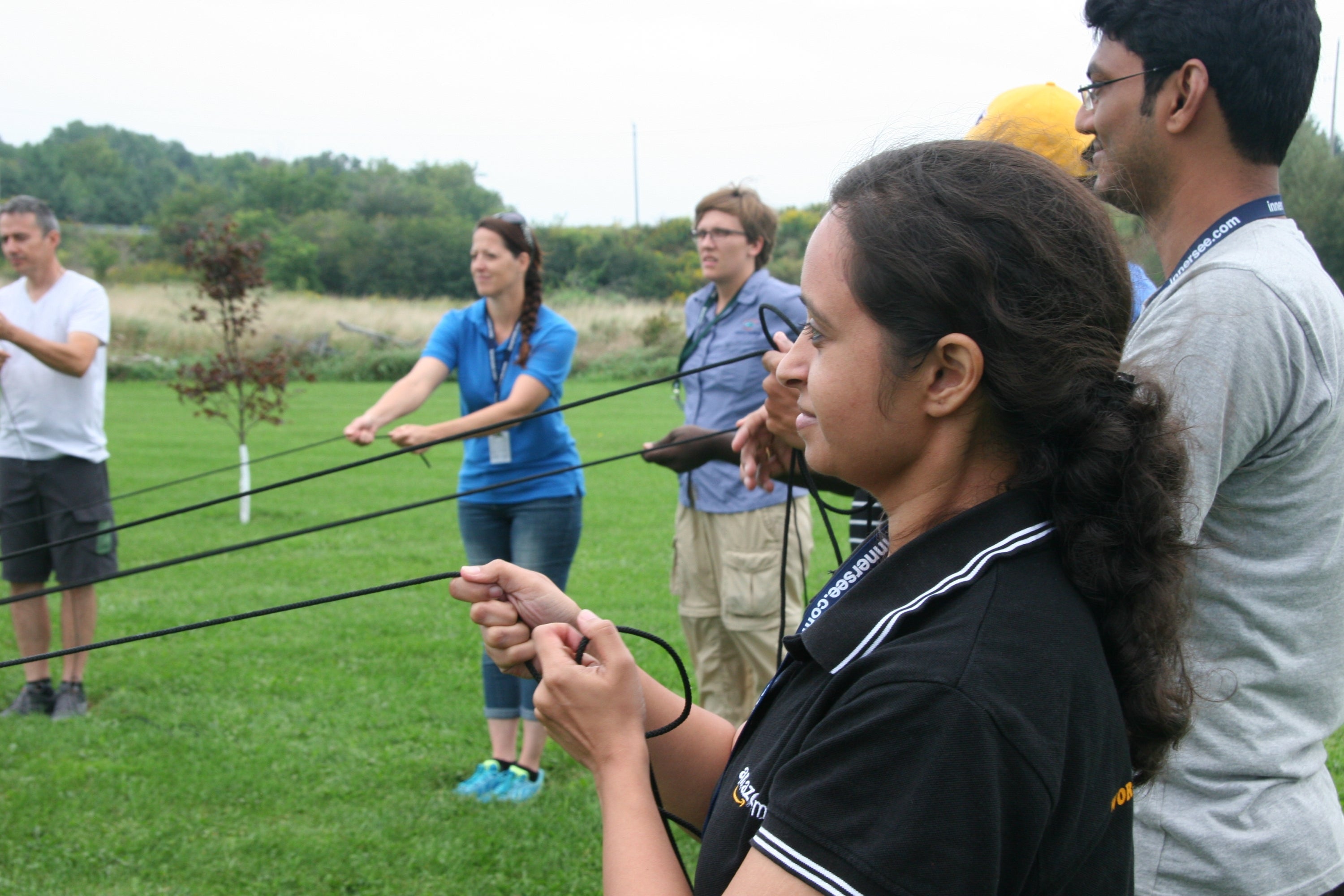Students holding rope during group activity