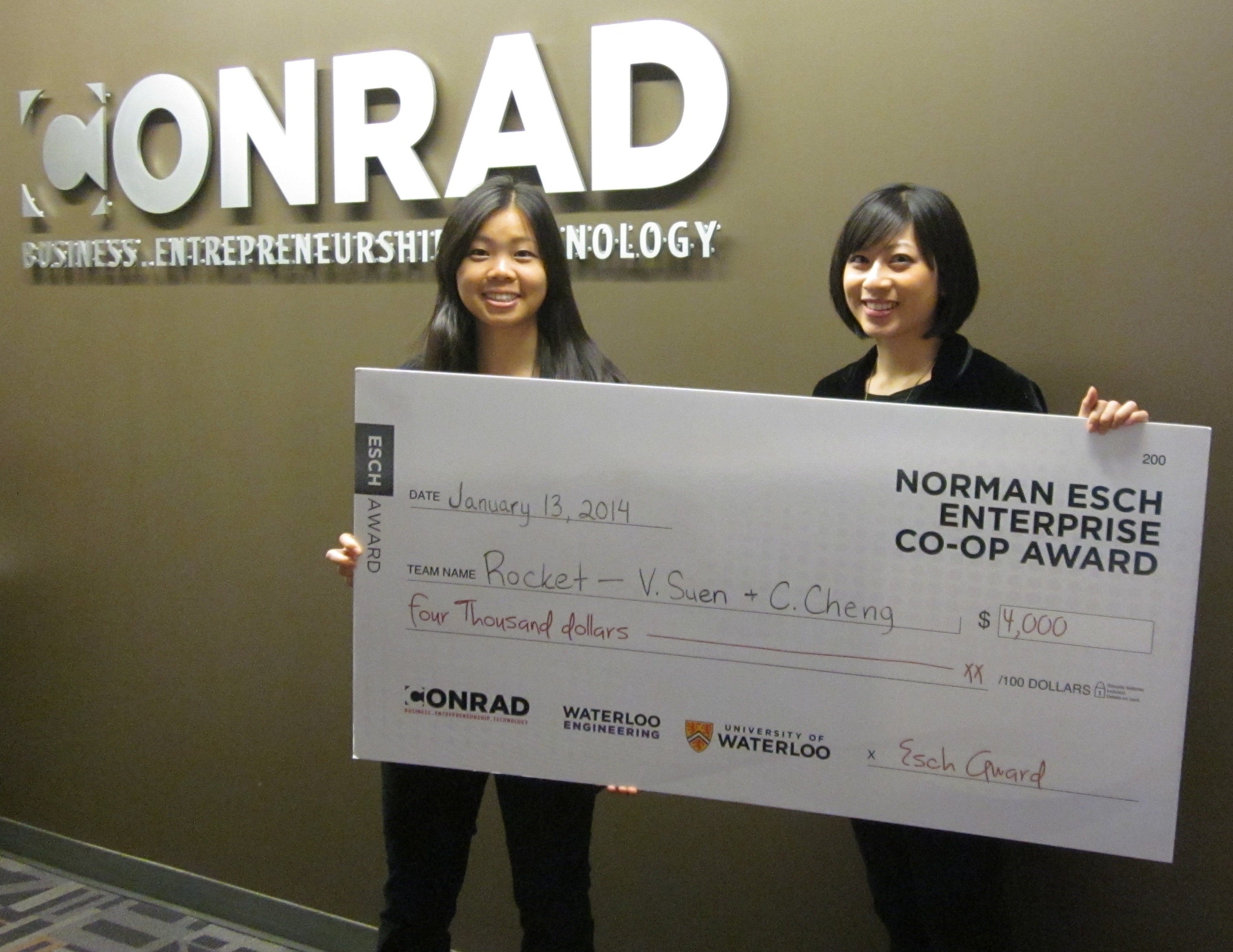 Victoria Suen and Carrie Cheng hold their $4,000 award for Rocket.