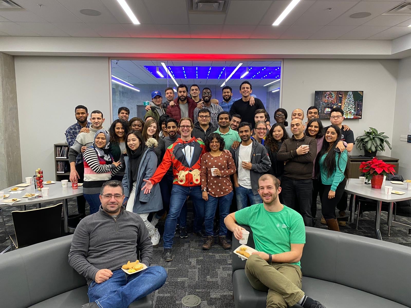 Winter break celebrations: Full-time MBET students gather in the Conrad School Hub to celebrate before the winter holiday break.