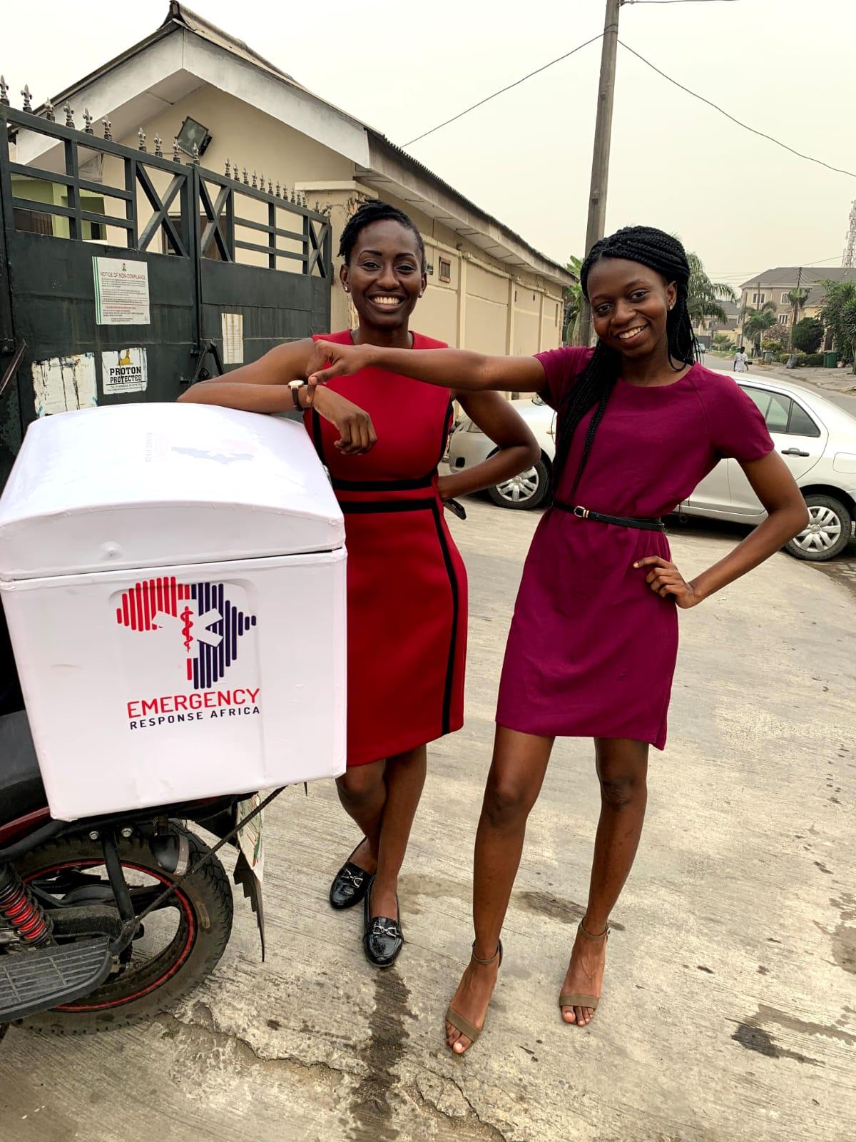 Folake Owodunni and Maame Poku on site next to an ERA service bike.