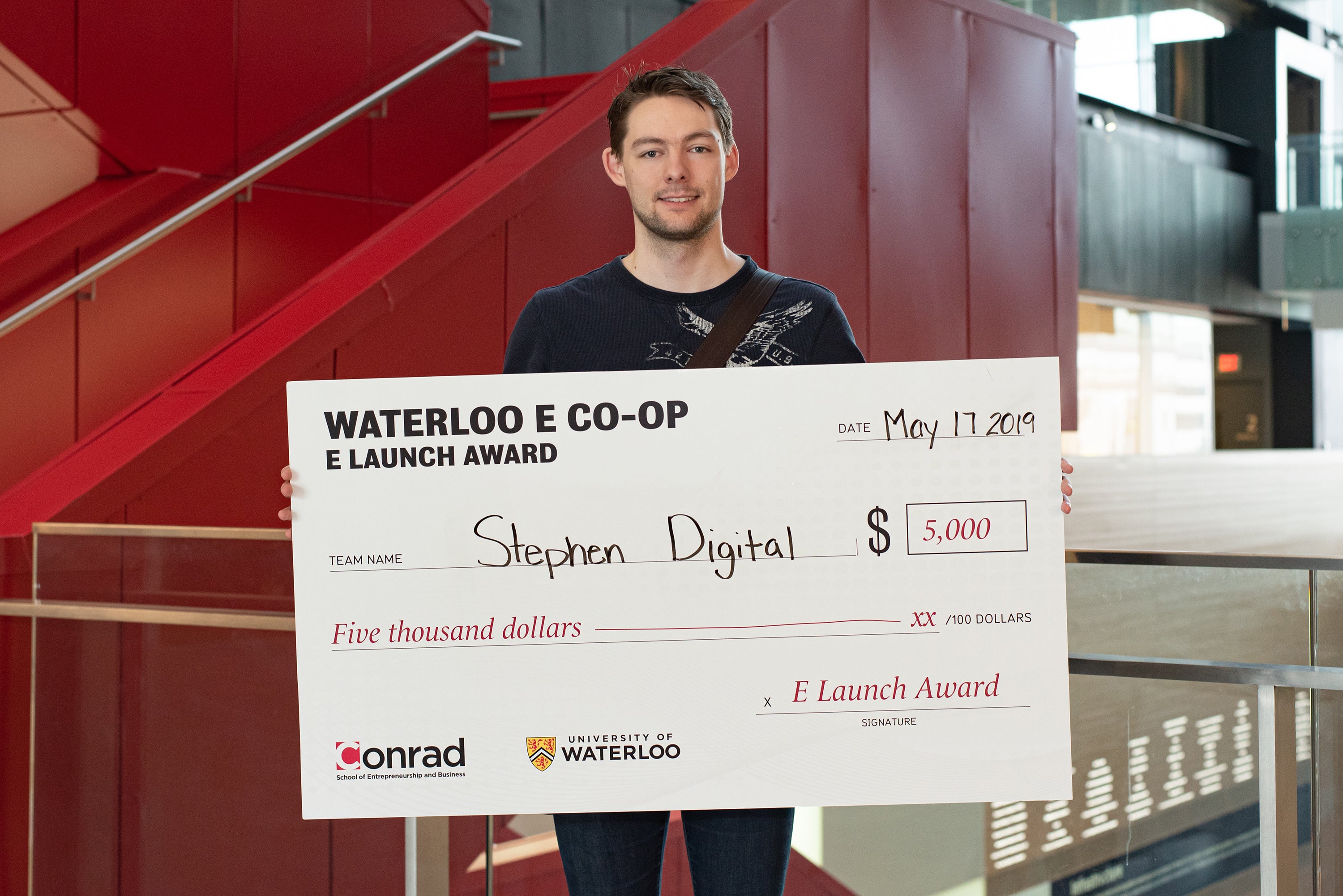 Patrick Stephen with award cheque.